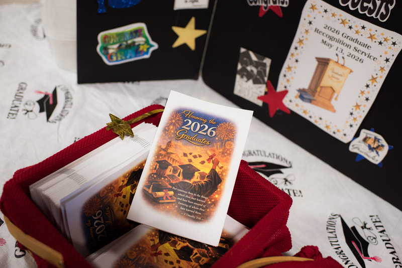 Printed programs and a display honoring 2026 graduates